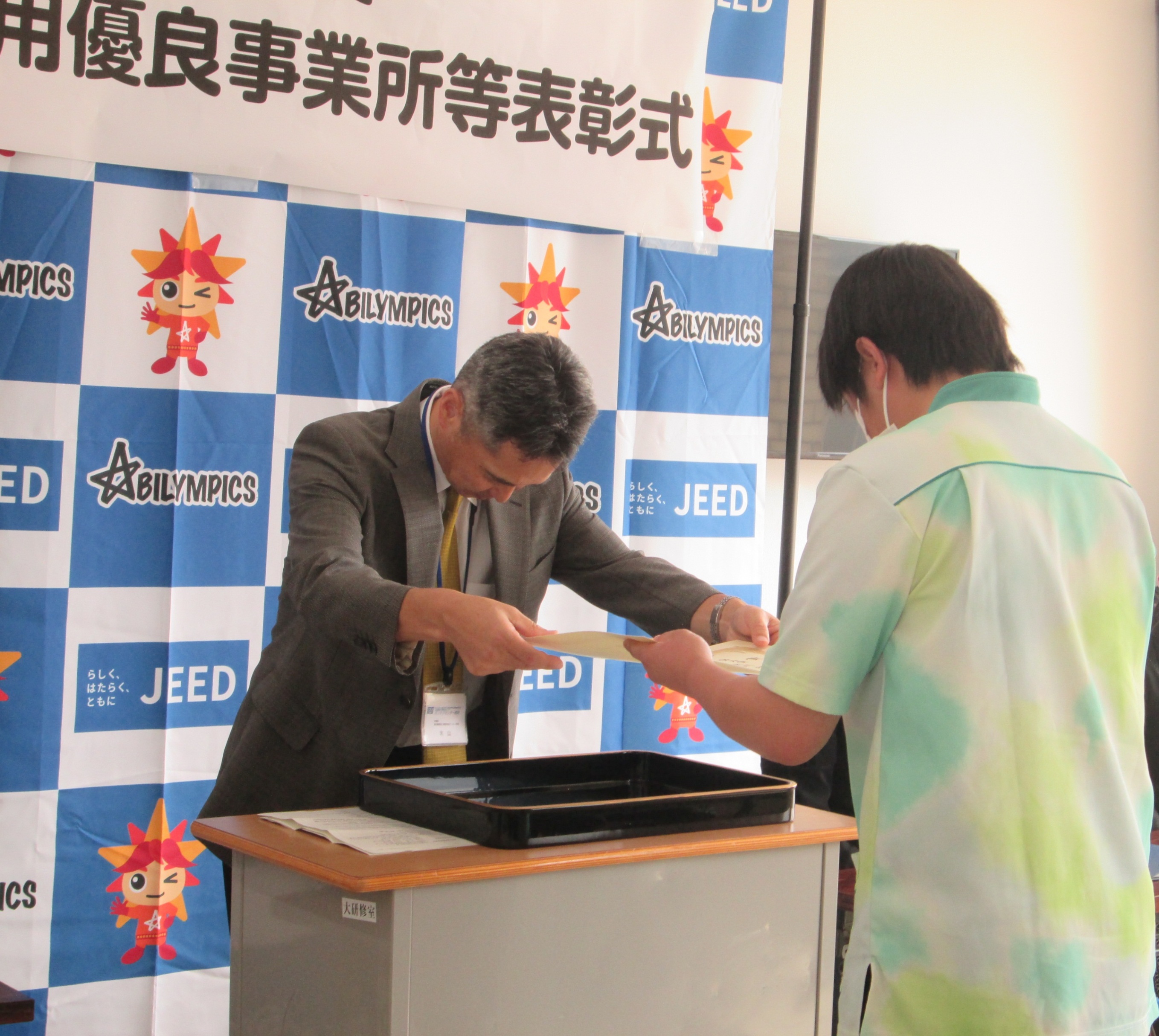 受け渡し写真